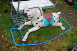 A plastic rocking horse.