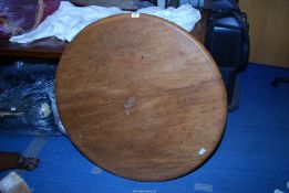 A circular table having paw feet - 41" diameter x 28" high.