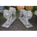 A pair of concrete Lions with a paw on ball - 22" high x 27½" long x 8½" diameter.