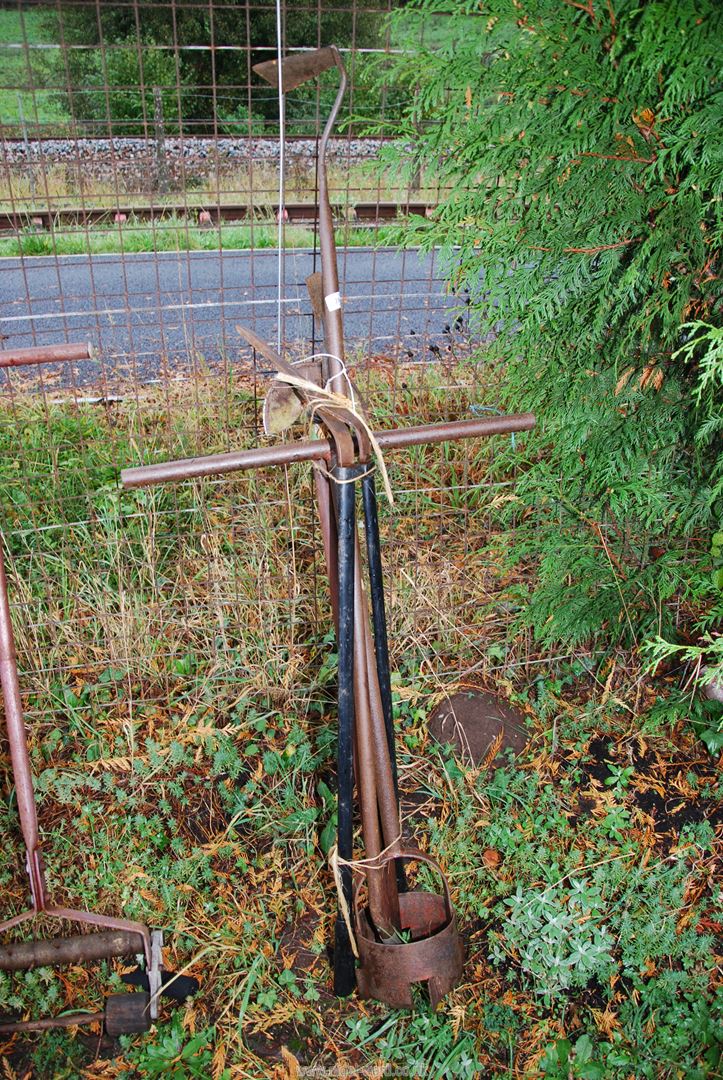 A hole auger, edging shears, and cultivators.