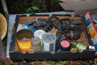 A lead light, oil cans, brass blow torch, nails, clamp etc.