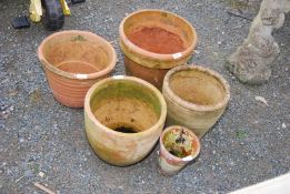 Five clay pots.