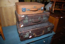 Three suitcases including leather.
