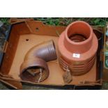 A terracotta Chimney Pot Cowl, and a 90° Salt Glazed Drainage elbow joint.