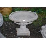 A concrete urn - 23½" x 16½" high.