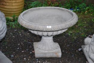 A concrete urn - 23½" x 16½" high.