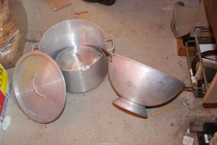 A very large Colander, plus a large aluminum saucepan with lid and spare lids.