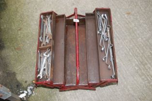A cantilever tool box with ring and open-end spanners.