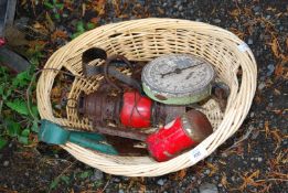 A basket, scatter scales, dagging shears, and old tilley lamp.