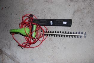 A 'Garden Essentials' electric hedge trimmer.