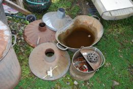 A galvanised bath, three incinerator lids, a galvanised mop bucket with controls.