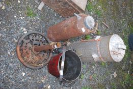 A vintage fire extinguisher, a galvanised red bucket, umbrella stand,