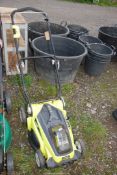 A Ryobi battery operated lawn mower - 36 volt.
