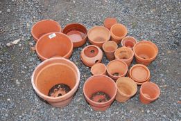 A quantity of clay pots and saucers.