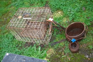 Two cages, plus a glue pot and cast iron pan.