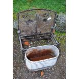 A spark guard, dog basket, and a galvanised oval planter.