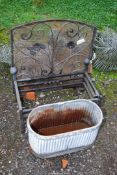 A spark guard, dog basket, and a galvanised oval planter.