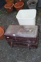 A plastic flip lid waste bin and a metal tool chest.