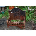 A Fire Dog Grate with coat of arms - 20" high x 20" across, (Grate 19½" x 11").