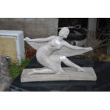 A concrete art Deco style female figure - 16½" high x 23" long x 7" deep.