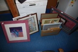 A quantity of pictures and picture frames.