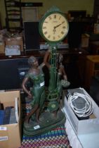 A Juliana clock with two deco lady figures to the base.