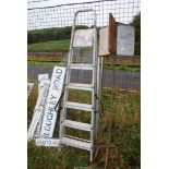 A six rung aluminum step ladder.