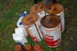 Drums containing damp proofing and jugs.