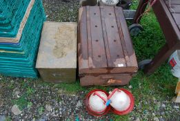 A metal trunk, brass slipper box and two plastic poultry drinkers.