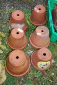 Six Terracotta pots.