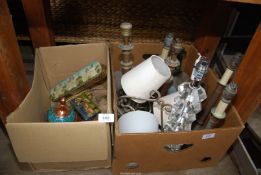 A box of old table lamps, candle stick holder and old tins, etc.