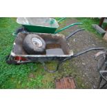 A wheelbarrow with pneumatic tyre and a wheel and tyre 15 x 6.00 x 6.