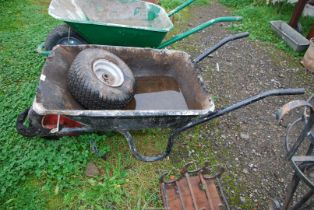 A wheelbarrow with pneumatic tyre and a wheel and tyre 15 x 6.00 x 6.