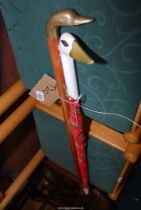 An umbrella with Swan head and a walking stick with duck handle.