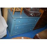 A blue painted chest of three drawers 48'' x 23 1/2'' x 35'' high.