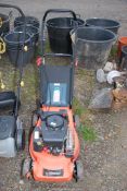 A 'Sovereign' 4 stroke petrol engine mower with grass box - good compression.