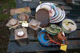 A quantity of enamel ware, bowls, dishes, chamber sticks and tea light lanterns, etc.