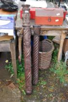 Two grape vine carved pillars - 34" and 45" tall.