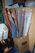 A quantity 12 rolls of fabrics.