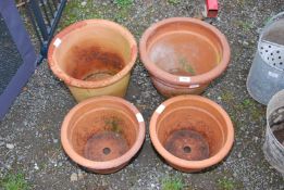 Two large Terracotta and two smaller planters.