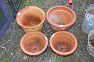 Two large Terracotta and two smaller planters.