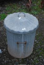 Galvanised lidded dustbin.