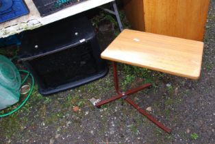 A Television cabinet and adjustable bedside table.