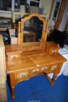 A dressing table with swing mirror - 39 1/2" x 18" x 3' high.