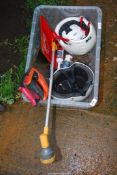 Two skate-boarding helmets, wood saws, and tubes of silicone, etc.