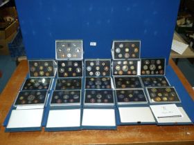A quantity of 1983-1999 UK Proof coins in cases and sleeves packed in blue leatherette boxes (17).