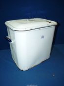 A white enamelled bread-bin with black highlights.