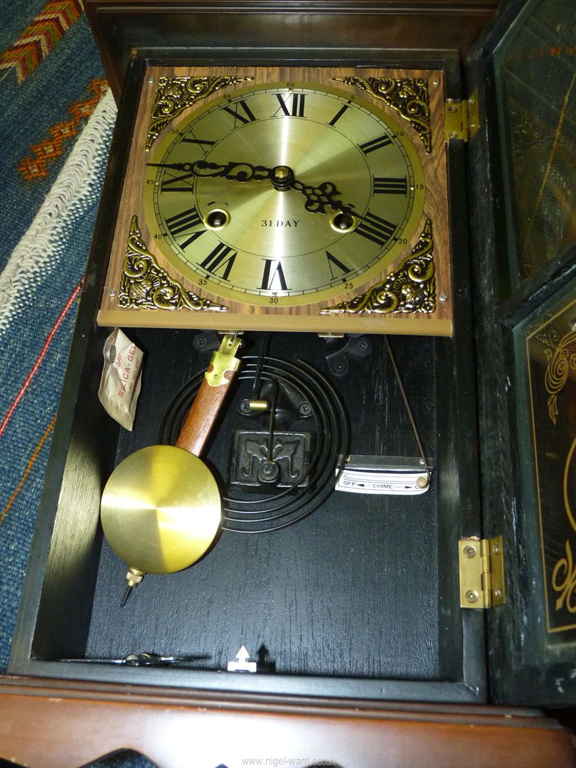 A cased 31 day chiming wall Clock having decorative brass corners around the face, - Image 2 of 2