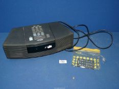 A Bose radio/CD alarm clock wave player.