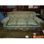 An elegant circa 1910 three-seater settee upholstered with chinoiserie style green ground satin